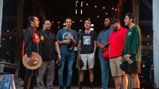 The Firewolf Singers perform the Traveler Song to close out the event.