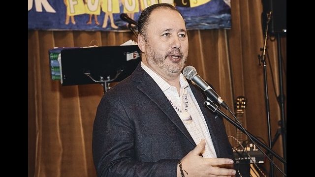 Chief Kirk Francis of the Penobscot Nation shared comments with the crowd Chief Kirk Francis of the Penobscot Nation stands at a microphone
